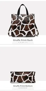 Detail view showing back and base of large giraffe print tote bag with black handles