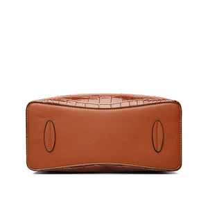 Caramel brown handbag base view showing crocodile texture and reinforced stitching