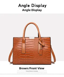 Detailed front view of brown crocodile pattern tote bag with metal buckle and dual handles