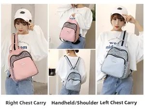 Pink and grey nylon backpack featuring reflective details and versatile carrying options