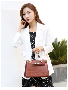 Brown faux crocodile leather handbag with printed silk scarf detail and gold metal lock