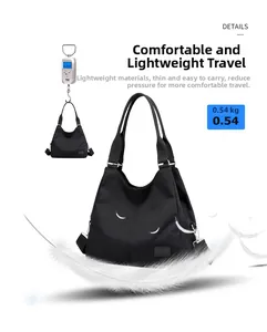 Macro shot showing lightweight 0.54kg black nylon tote bag with adjustable shoulder strap