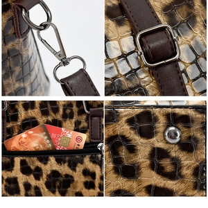 Nahaufnahme der Leopard-Tasche mit Metallbeschlägen, Riemen und schützenden Bodennieten
