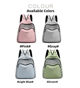 Detail view of Oxford fabric backpack showing pink grey light blue and green color options