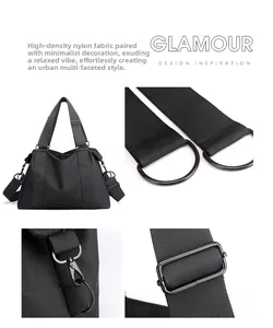 Dettaglio del tessuto in nylon ad alta densità e delle finiture in metallo nero della borsa