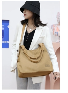 Khaki large capacity nylon crossbody tote bag with adjustable strap and brand logo detail