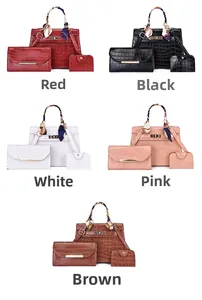 Detail of 3-piece bag set featuring crocodile pattern and scarf-wrapped handle design