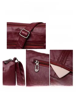 Dettagli in pelle bordeaux e finiture in argento lucido sulla borsa a tracolla
