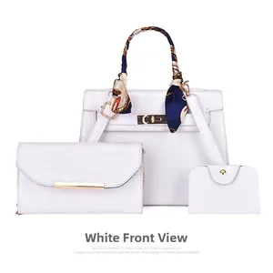 Detailed view of white 3-piece bag set with crocodile embossing and decorative scarf