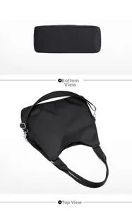 Detailed bottom view showing the width and nylon fabric texture of the black tote bag