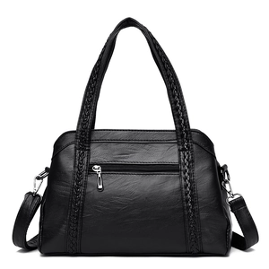 Black PU leather tote bag for women featuring woven details and adjustable shoulder strap