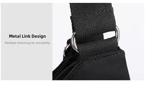 Close-up of black nylon shoulder strap with polished silver metal rings on tote bag