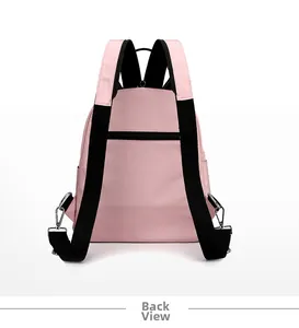Pink nylon backpack back view showing wide black shoulder straps and anti-theft zipper pocket