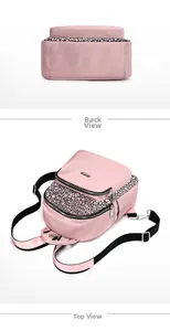 Detail view of pink oxford fabric backpack showing bottom base and geometric maze pattern