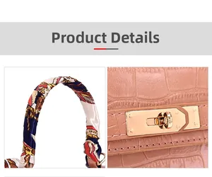 Detail of pink croc-embossed handbag showing silk-wrapped handle and metal lock