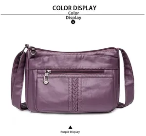 Dettaglio della borsa a tracolla viola in ecopelle con tasche multiple e trama intrecciata