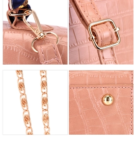 Detailed views of pink crocodile pattern handbag with gold metal hardware and magnetic buckle
