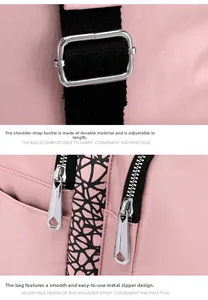 Detail of pink Oxford backpack featuring silver metal zippers and adjustable straps