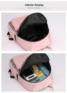 Internal view of pink oxford backpack showing large capacity and zipper pocket layout