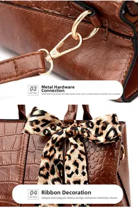 Close-up of golden hardware and leopard print ribbon bow on brown crocodile texture handbag