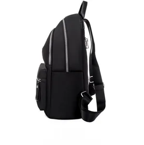 Side view of black nylon backpack with silver zippers and multiple zip pockets
