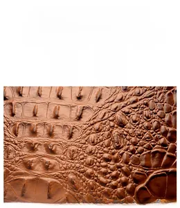 Detail of dark brown crocodile pattern leather showing waterproof and soft texture
