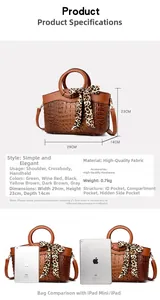 Detail view of brown crocodile texture handbag with leopard bow and size dimensions