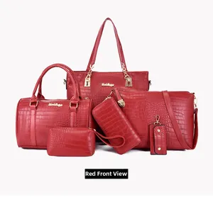 Detail view of 6-piece red tote set with embossed crocodile texture and gold hardware
