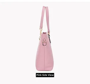 Side view of pink crocodile pattern tote bag with golden hardware and handles