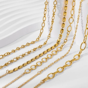 Gold plated stainless steel Cuban links and chain necklaces set on white props