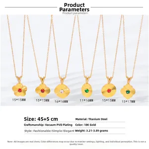 Macro detail of 18K gold-plated titanium clover necklaces with cubic zirconia and colored gems