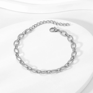Detail of silver stainless steel hip hop chain showing polished and threaded oval links