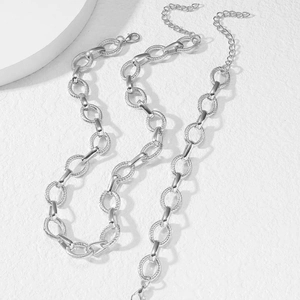Close-up of hip-hop style stainless steel twisted rope and polished chain links