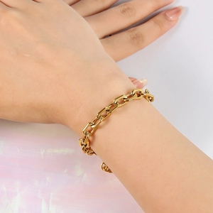 Detail of 18K gold plated stainless steel chunky link bracelet worn on wrist