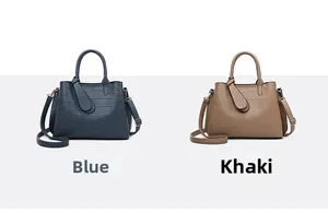 Detail view of khaki and blue embossed leather tote bags with long zipper pullers