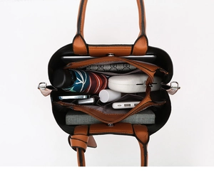 Top view of large brown leather tote bag interior with multiple storage compartments