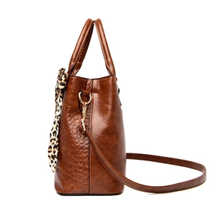 Caramel brown crocodile embossed tote bag with leopard silk scarf and adjustable strap