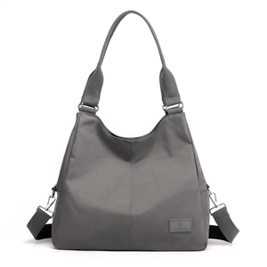 Large gray nylon tote bag with adjustable shoulder strap and spacious interior