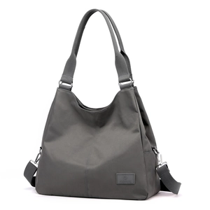 Deep grey large capacity nylon tote bag with adjustable shoulder strap and brand logo