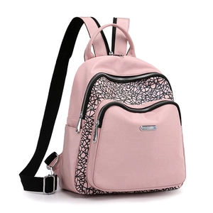 Pink oxford cloth backpack with black geometric side details and adjustable straps