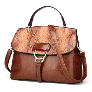 Vintage brown oil wax leather shell bag with snakeskin patchwork and metal ring buckle