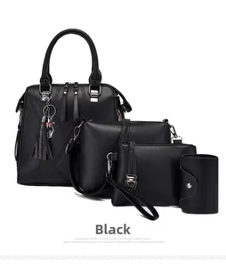 Detail of four-piece black faux leather bag set including tote with cat charm