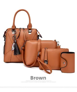 Detailed close-up of brown 4-piece handbag set featuring tassel and cat charm