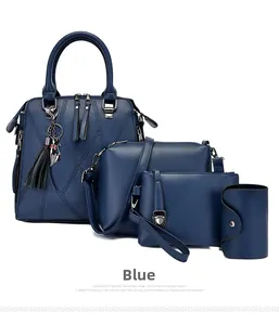 Detailed set of four blue faux leather handbags with a cat charm and litchi texture