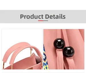Détails du sac à main en cuir rose avec anneaux dorés, pompon noir et doublure imprimée