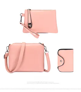 Detailed set of pink PU leather crossbody bag, wristlet clutch and card holder accessory