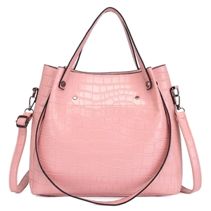 Pink faux leather handbag with crocodile pattern, top handles, and adjustable shoulder strap