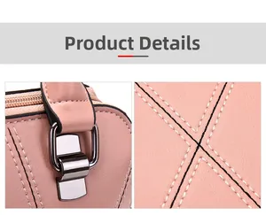 Close-up of pink lychee grain leather, gold metal buckle and X-shaped stitching detail