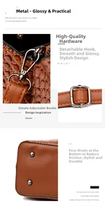 Detail of brown crocodile pattern handbag with gold hooks and protective bottom studs