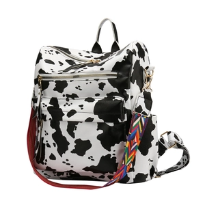 Sac à dos tendance motif vache noir et blanc avec bandoulière tissée colorée pour femme